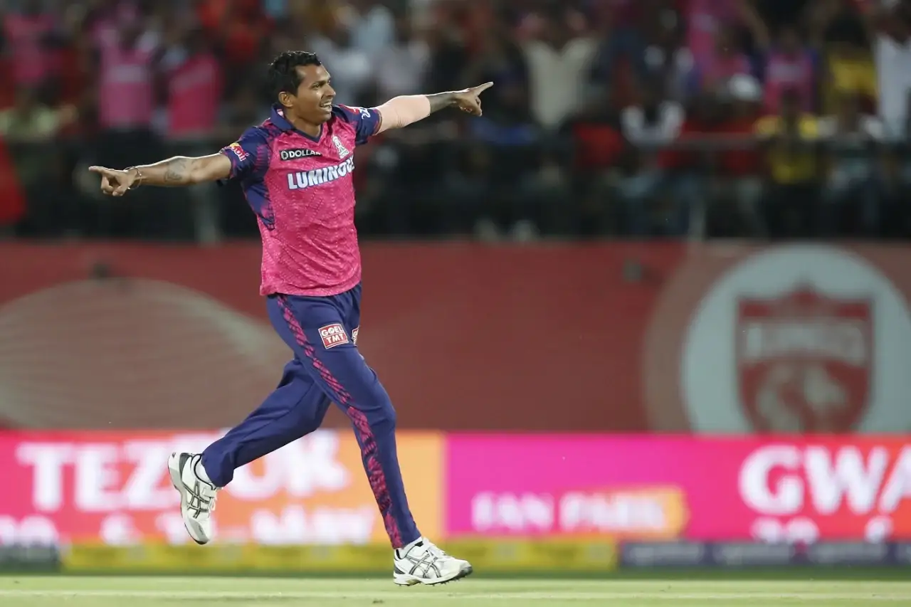 Navdeep Saini takes a wicket in IPL and celebrates.