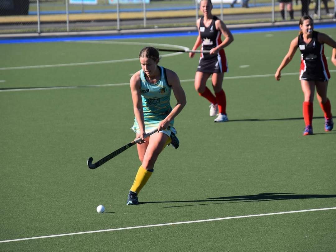 Phoebe Litchfield playing hockey pretty early on in her career