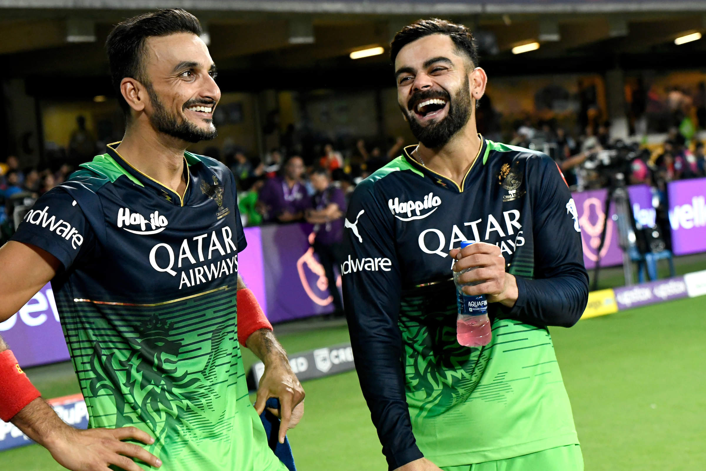 Harshal Patel with then RCB skipper Virat Kohli sharing a laugh
