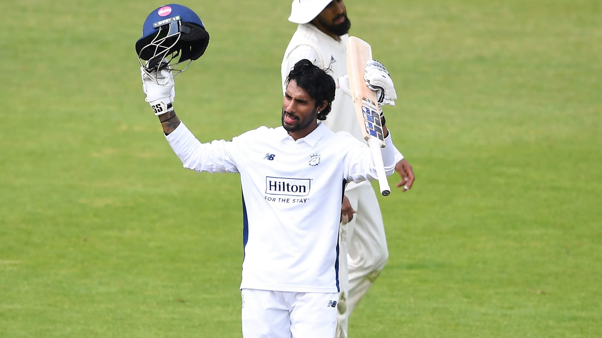 Tilak Varma raising his bat after century against Nottinghamshire