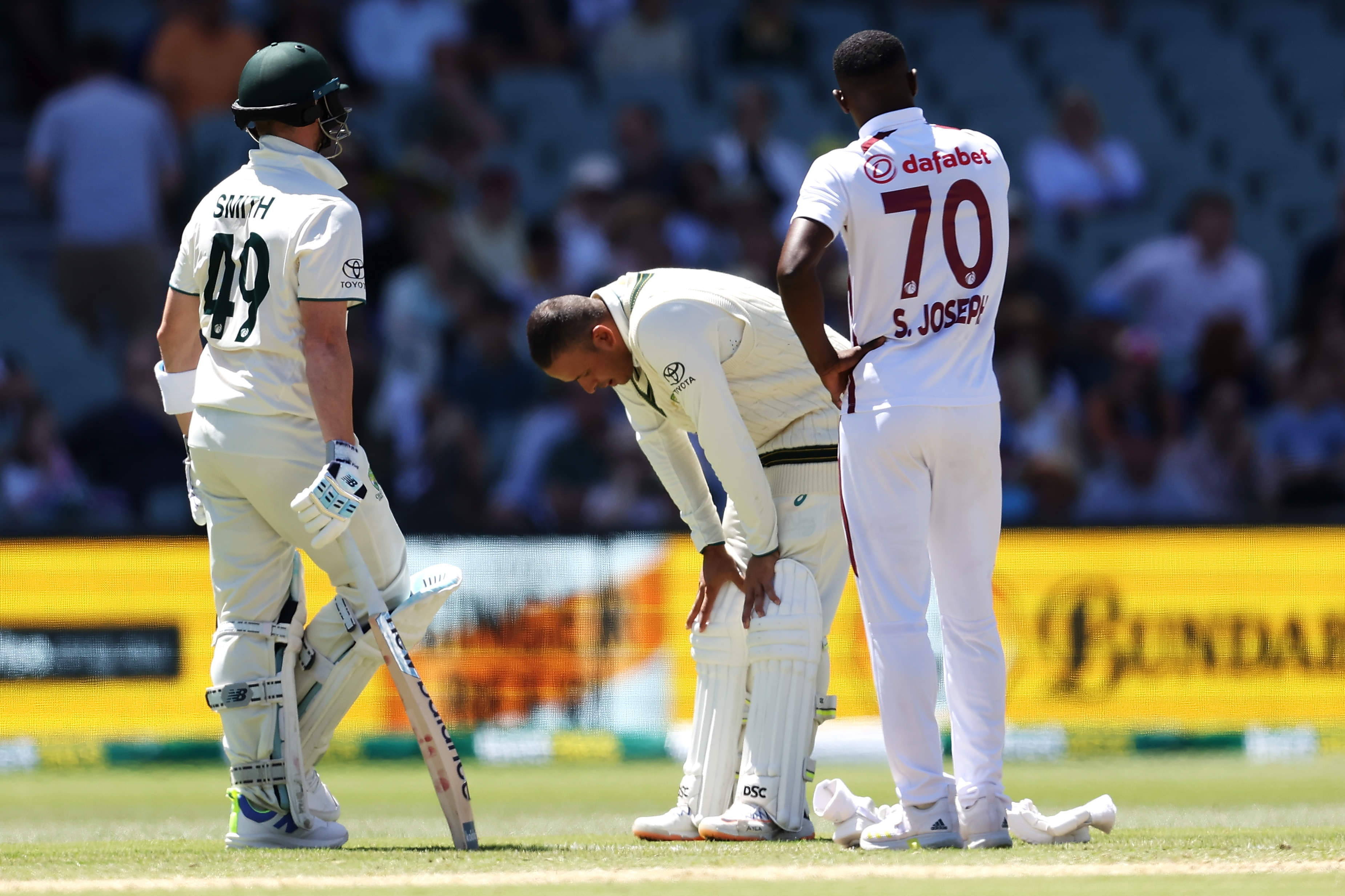 Khawaja walks off concussed after being rattled by a Shamar Joseph bouncer